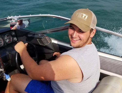 BOATING ON WALLOON LAKE ENJOYING SUMMER