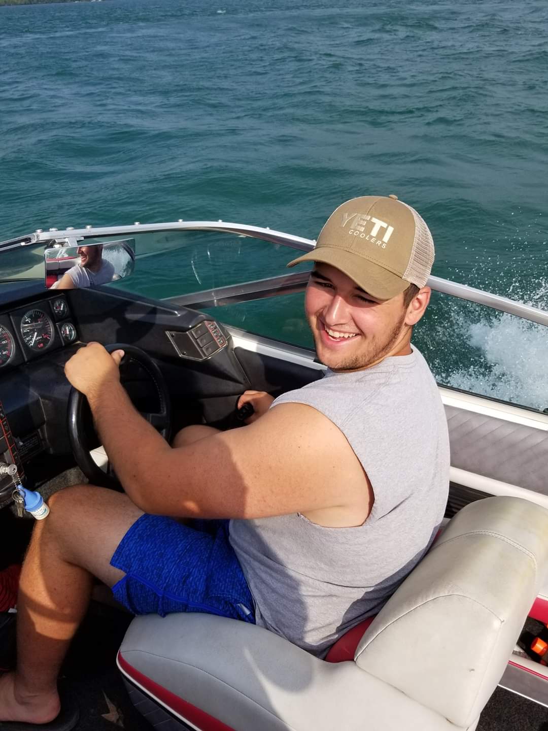 BOATING ON WALLOON LAKE ENJOYING SUMMER