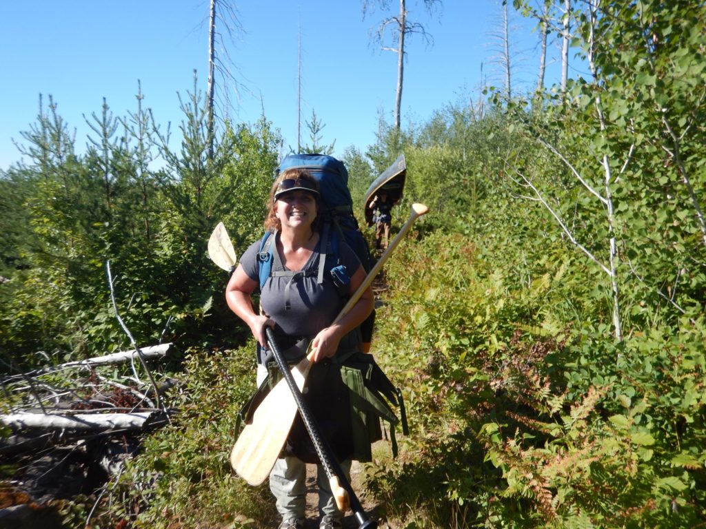 Single Portaging with pack and canoe